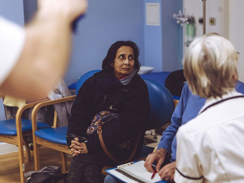 Asian woman waiting in hospital waiting room