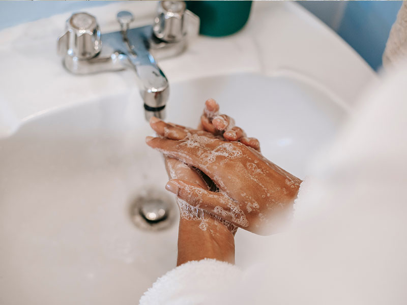 Washing hands in sink