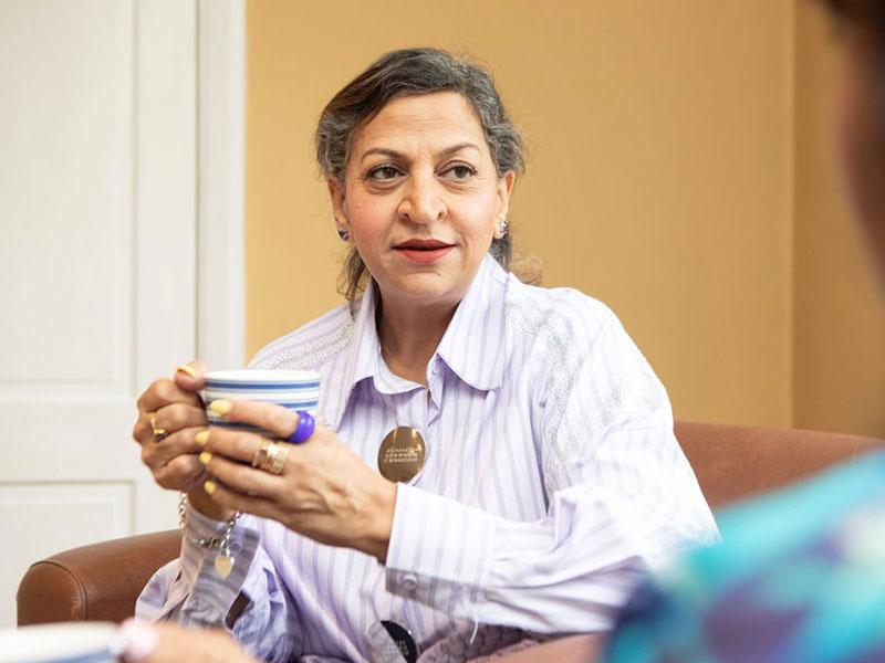 WOman having cup of tea chatting